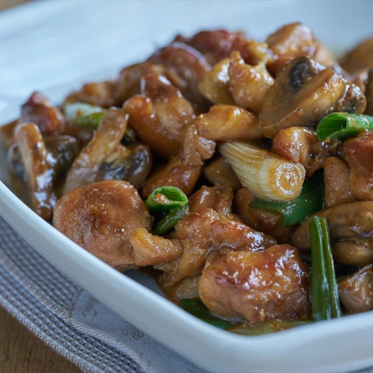 Pollo con champiñones en salsa de ostras