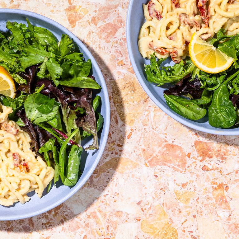 Udon Carbonara with Sun-Dried Tomato Bacon & Mixed Greens